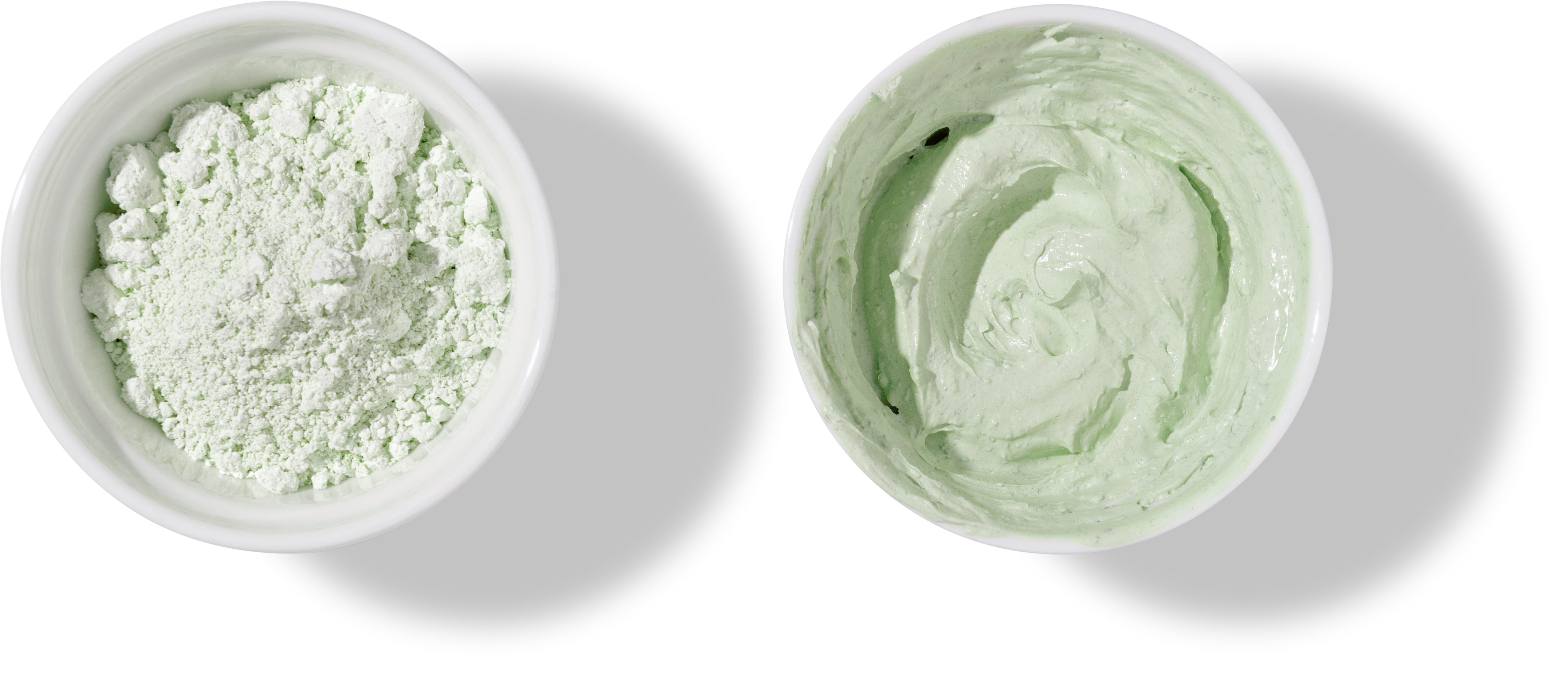 White bowls with green cosmetic clay on transparent background - mineral powder, bentonite facial mask. Skincare beauty concept.